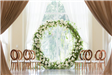 Indoor wedding setting with large flower ring