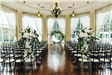 Indoor wedding ceremony with large flower ring