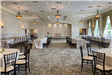 Indoor reception setting with long rectangular tables