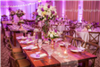 Square table with large floral arrangement