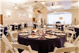 Round tables with tall floral arrangements