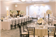 Mix of long and round tables with tall and short floral arrangements