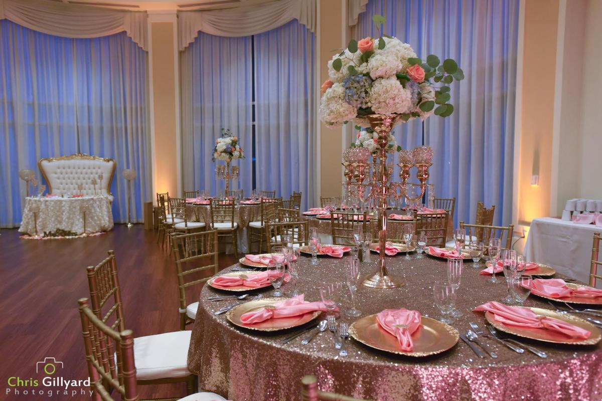 Round table with tall floral arrangement
