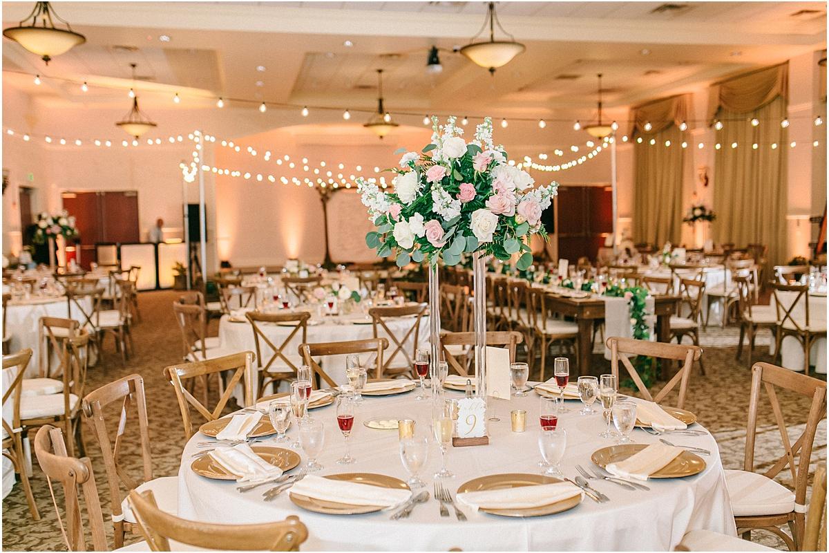Tall floral arrangement on round table